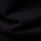 Close-up of the fine knit texture on the men's black half-zip pullover