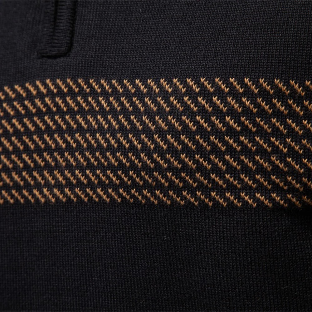 Close-up of the tan jacquard stripe knitted across the chest of the half-zip pullover
