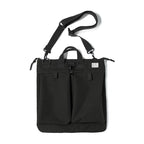 Charcoal helmet messenger bag on white with the detachable shoulder strap and twin top handles