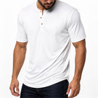 Man wearing the white everyday henley with dark jeans