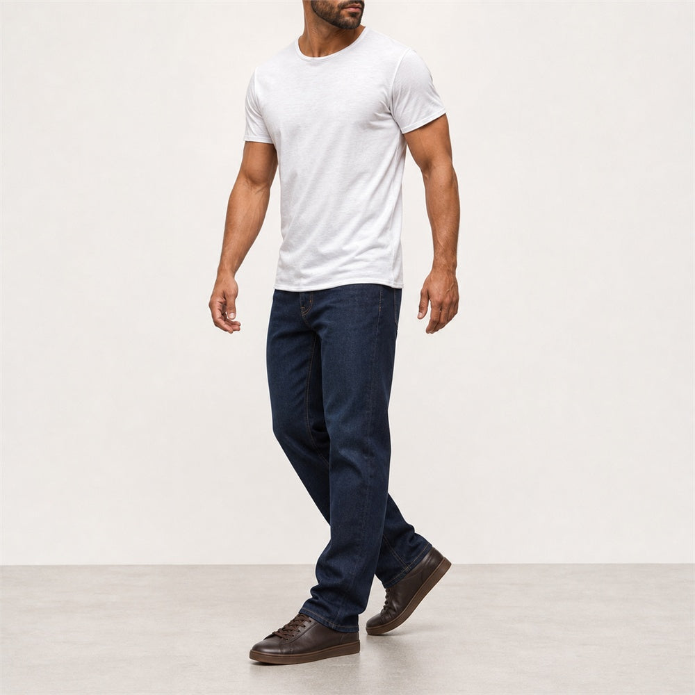 Man wearing the white textured crew neck t-shirt with dark jeans