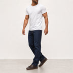 Man wearing the white textured crew neck t-shirt with dark jeans