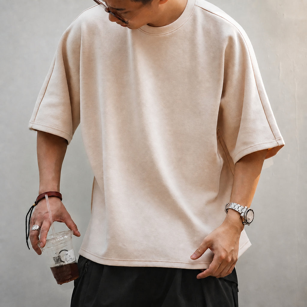 Front torso view of the beige oversized boxy tee