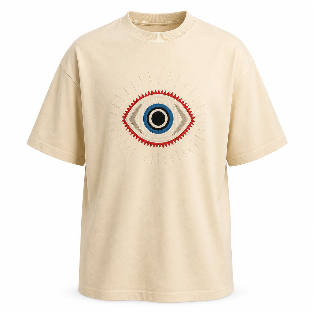 Beige t-shirt with embroidered guardian eye motif, invisible mannequin front view