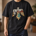 Man wearing the washed black thunderbird tee with dark jeans