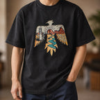 Man wearing the washed black thunderbird tee with dark jeans