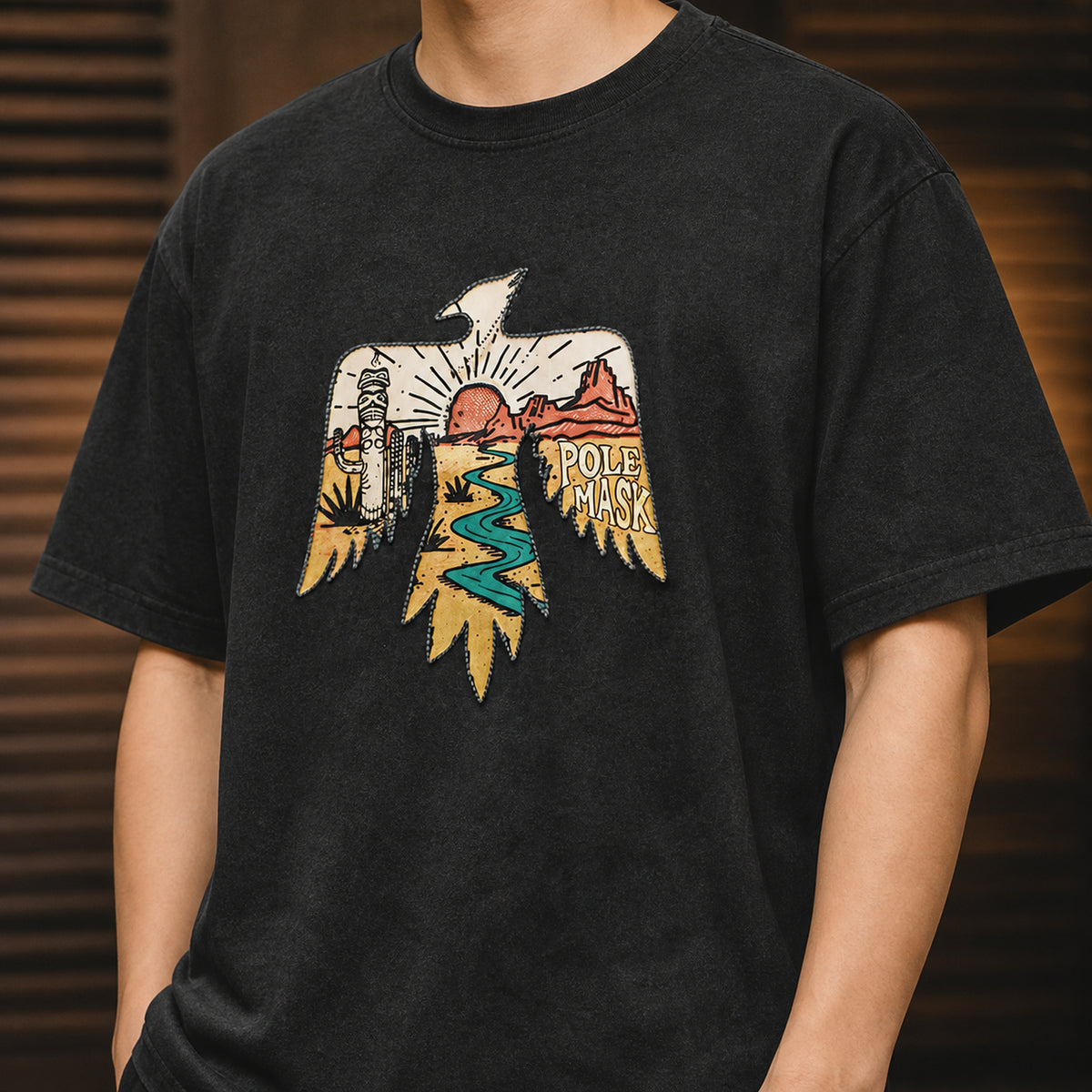 Front view of the thunderbird desert artwork on the washed black tee
