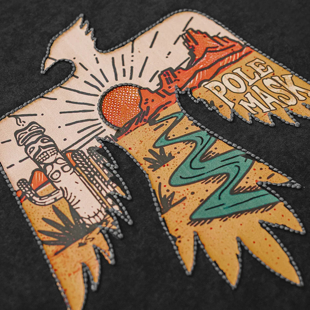 Close-up of the stitched thunderbird artwork showing the desert scene