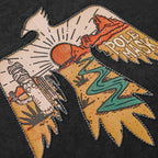 Close-up of the stitched thunderbird artwork showing the desert scene
