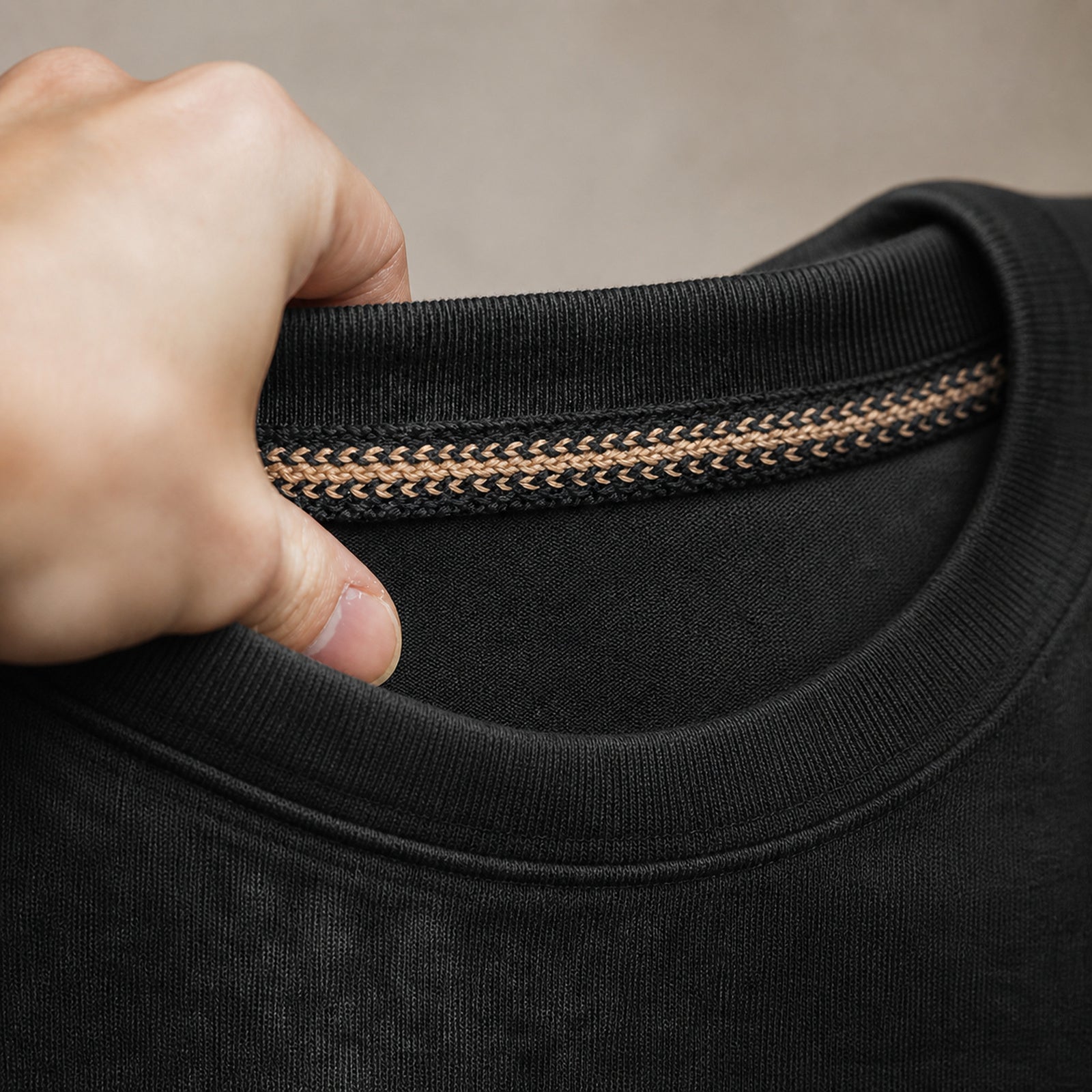 Close-up of the braided contrast neck tape inside the collar