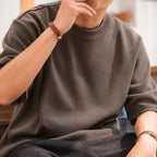 Close-up of the coffee brown boxy tee's thick knit fabric