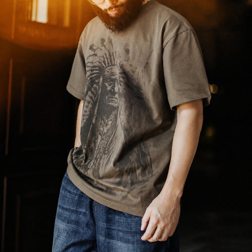 Man in the coffee chief portrait tee with blue jeans, warm light