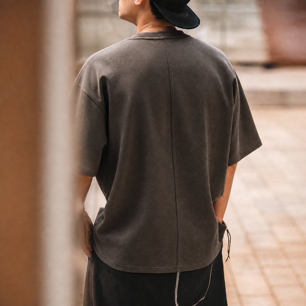 Back view of the coffee brown oversized tee with cap