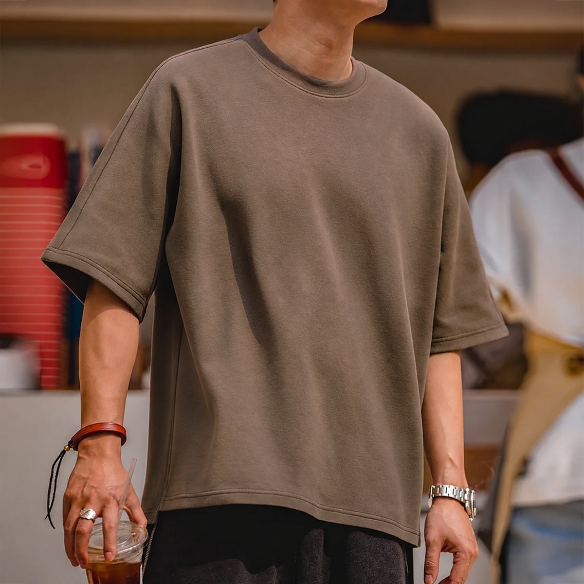 Front torso view of the coffee brown oversized boxy tee