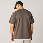 Back view of the coffee chief portrait tee with cap