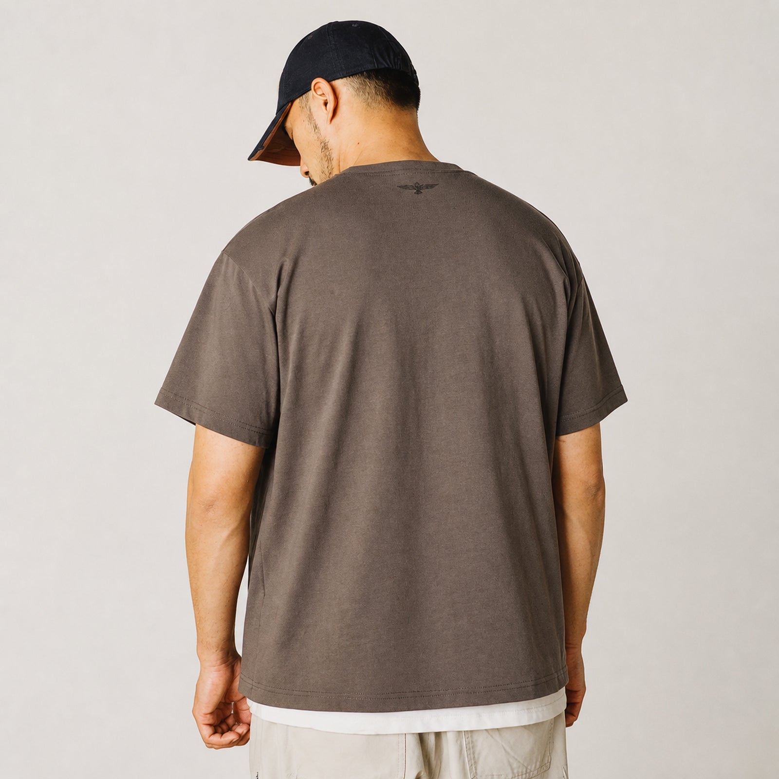 Back view of the coffee chief portrait tee with cap