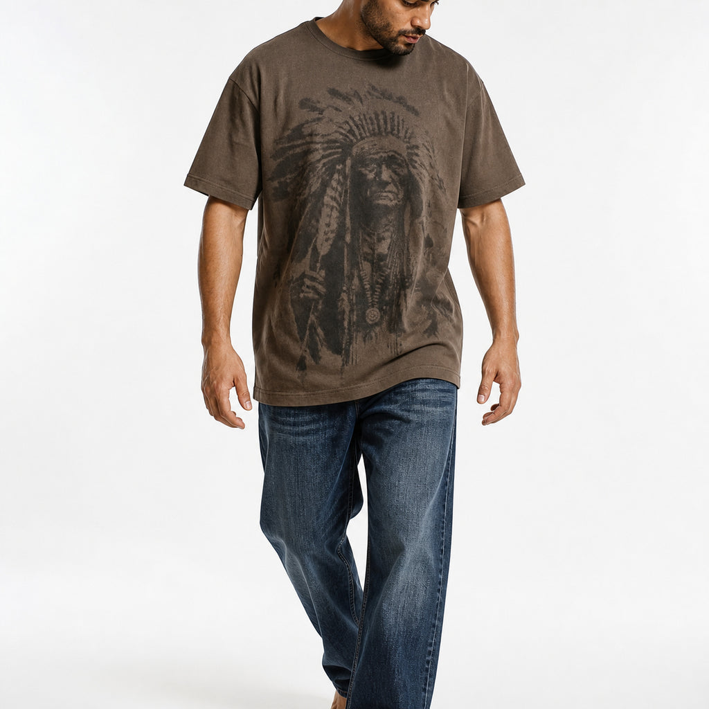 Man wearing the coffee chief portrait tee with blue jeans, full view