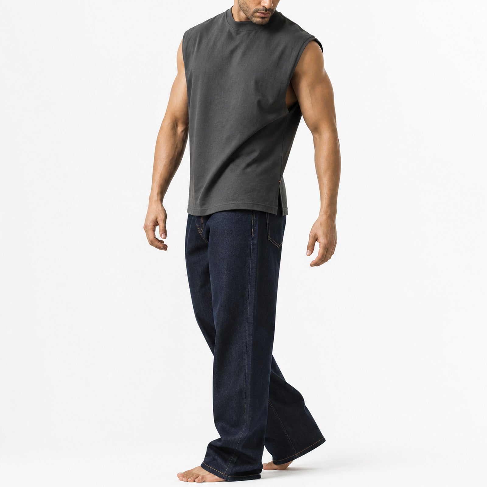 Man wearing the dark grey knit shoulder vest, walking, full view