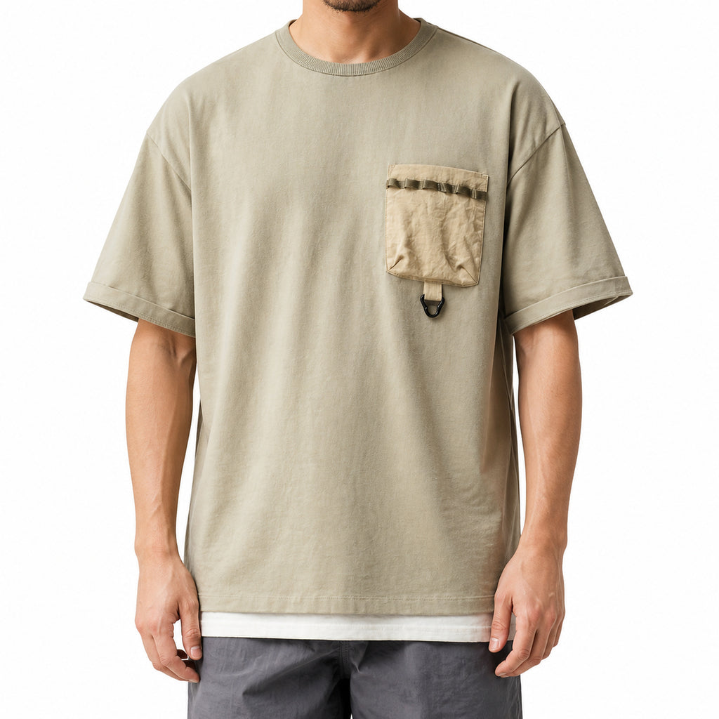 Front view of the sage green utility tee showing the braided trim pocket and loop