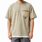 Front view of the sage green utility tee showing the braided trim pocket and loop