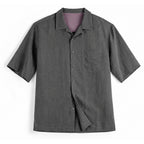 Grey lyocell camp collar shirt with chest pocket, flat front view