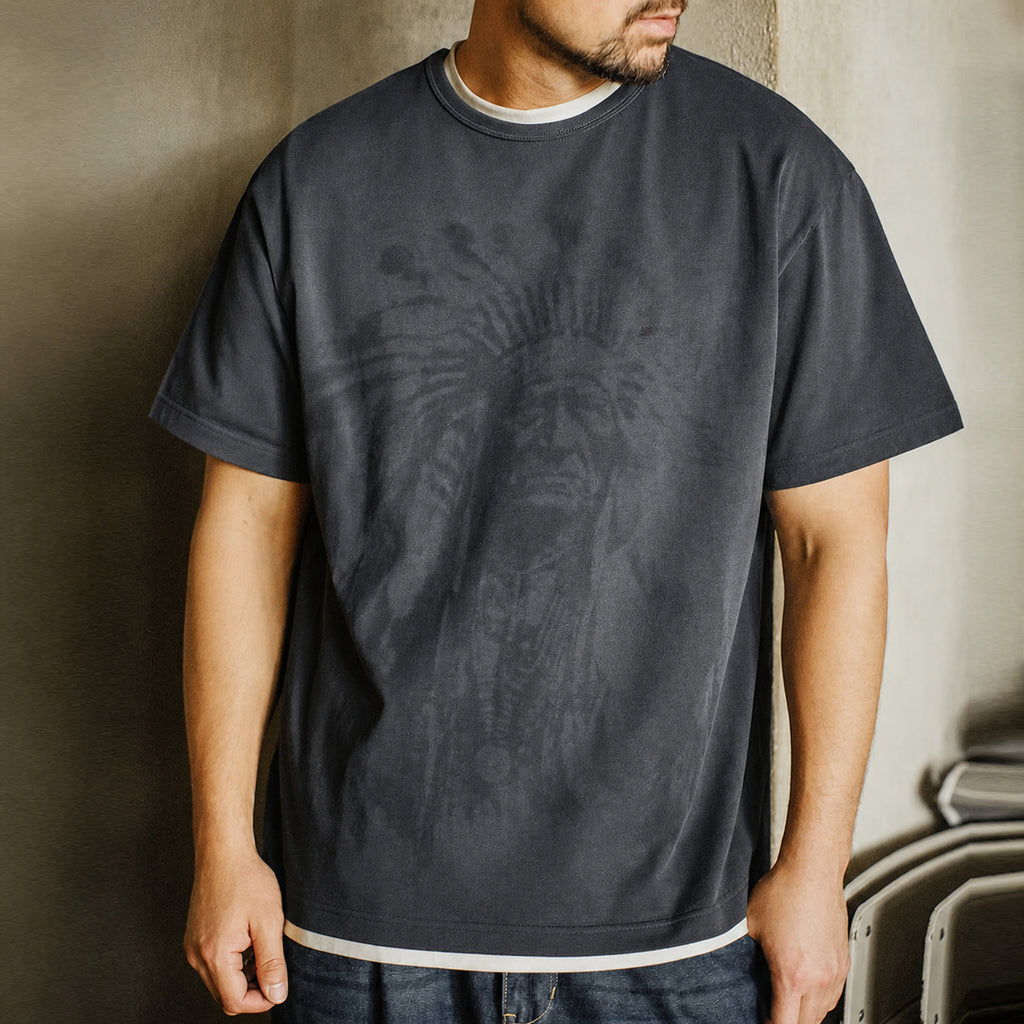 Man wearing the gray chief portrait tee layered over a white tee