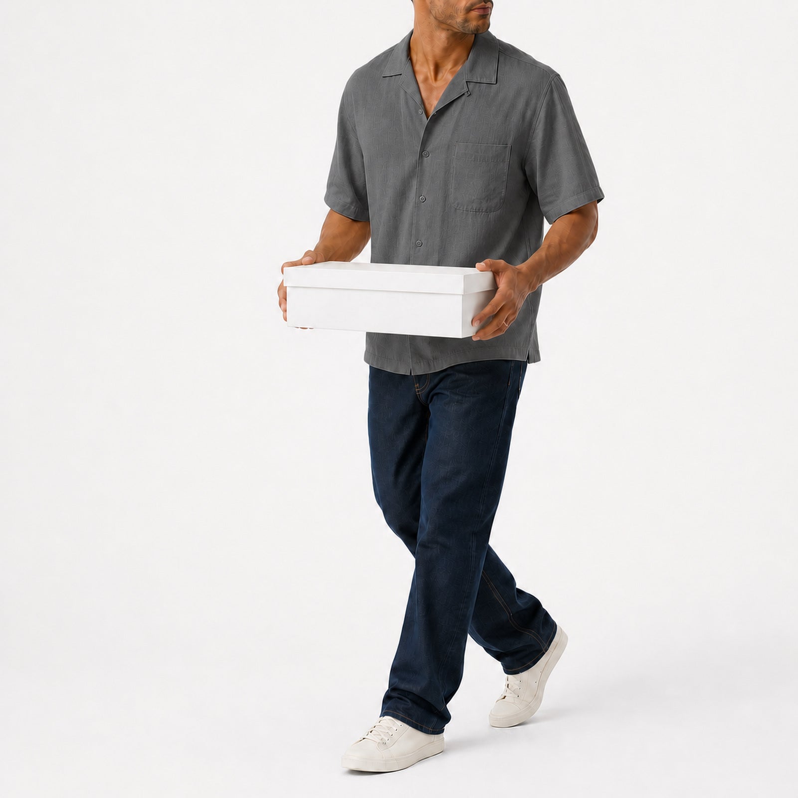 Man wearing the grey lyocell camp shirt with navy trousers, full view