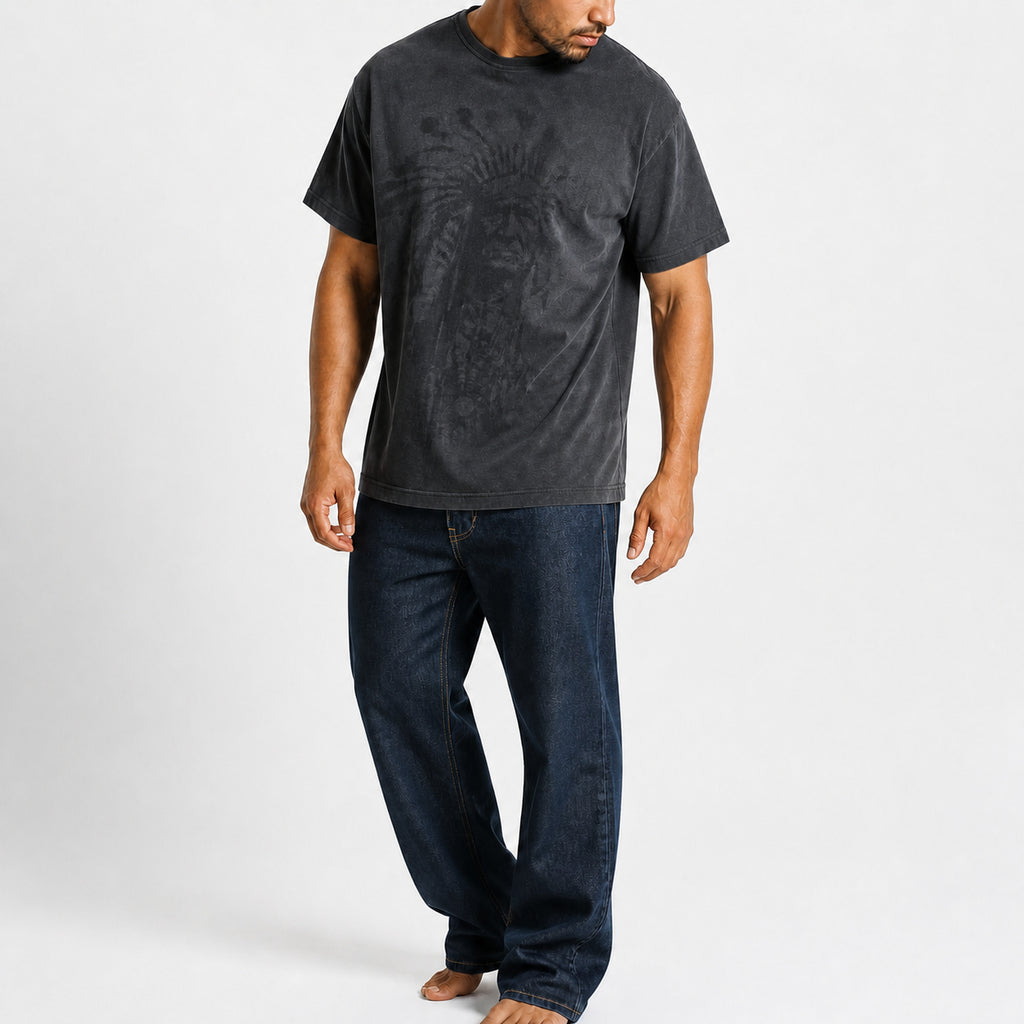 Man wearing the gray chief portrait tee with dark trousers, full view