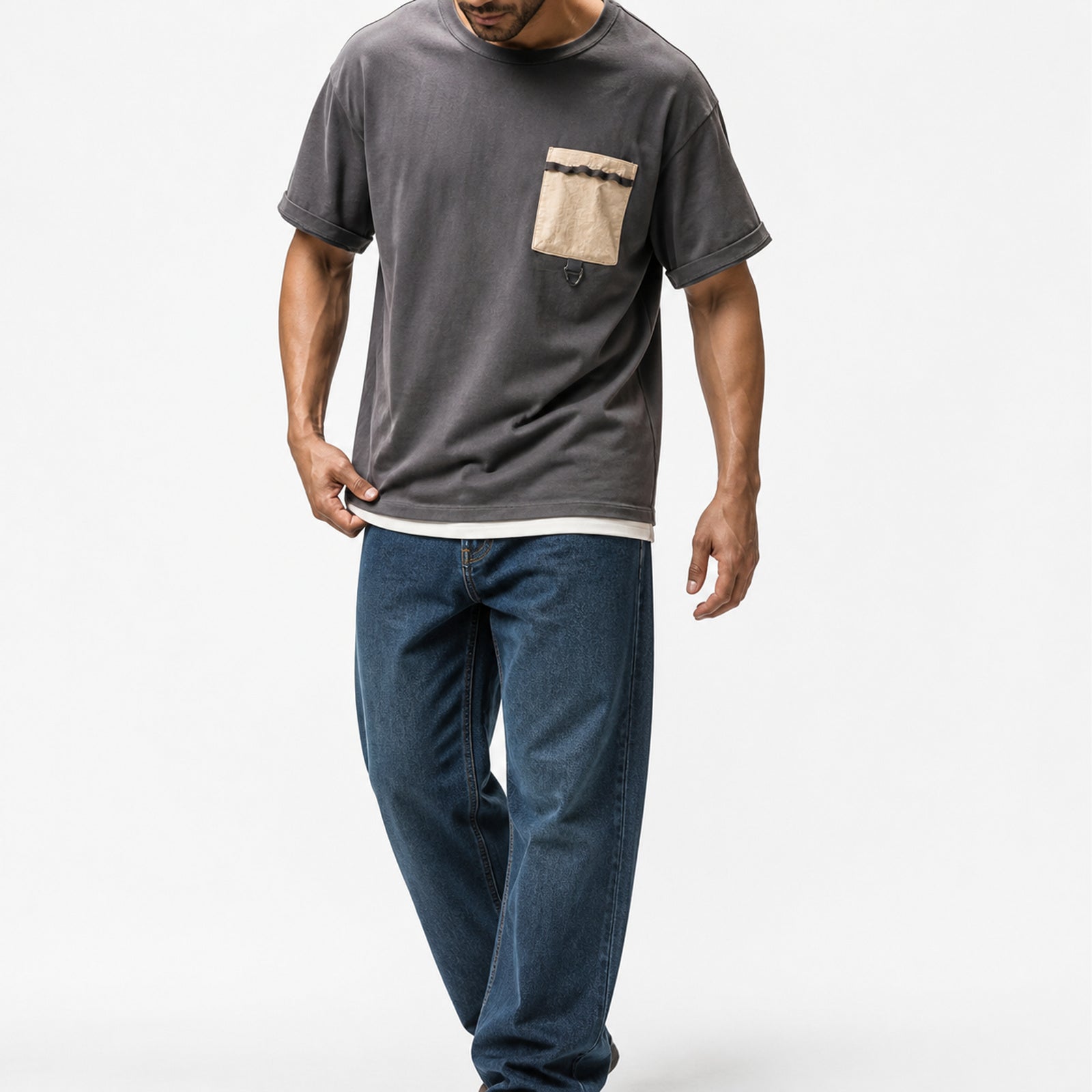 Man wearing the washed charcoal utility tee with blue jeans, full view