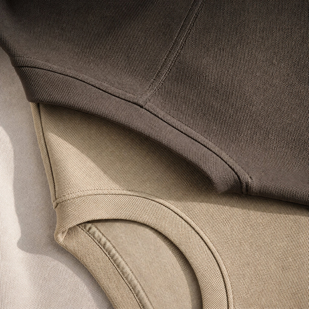Close-up of the khaki tee's curved hem and side slit