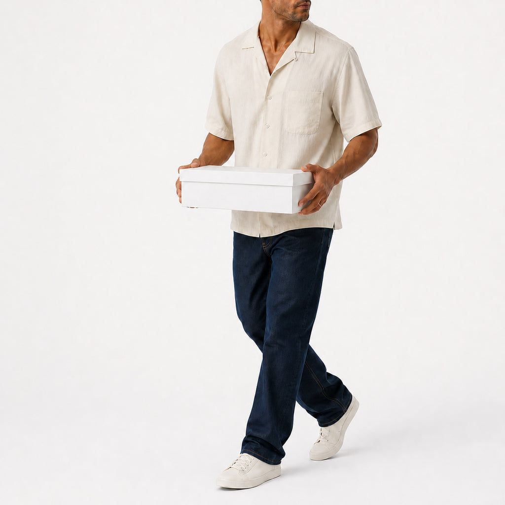 Man wearing the khaki lyocell camp shirt with navy trousers, full view