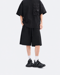 Black oversized snap-pocket T-shirt and wide-leg shorts set, front view