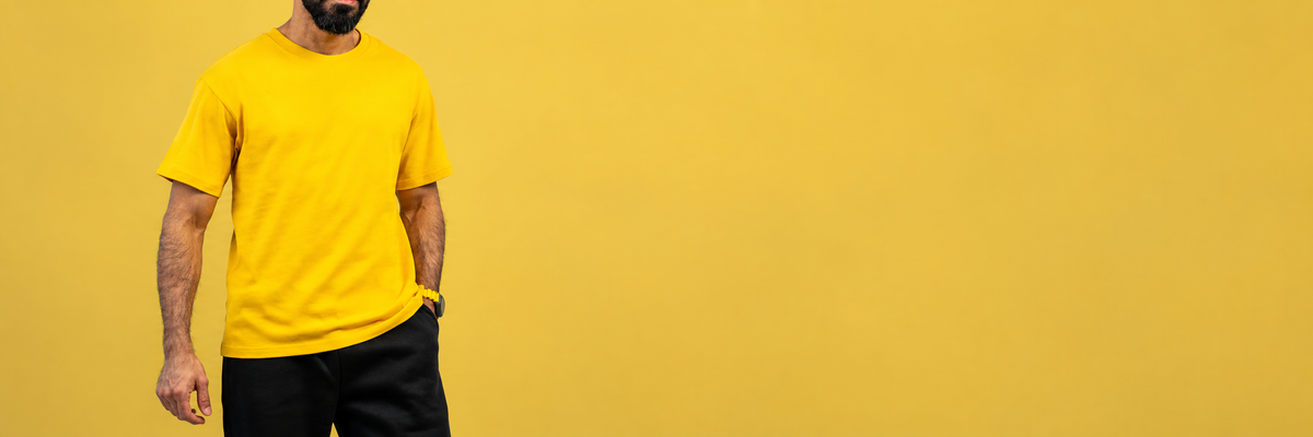 Close crop of a man in the Sunburst Yellow Essential T-Shirt with a yellow watch