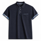 Navy pocket polo with indigo pattern trim at cuffs, flat front view
