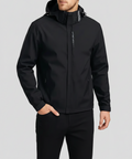 Man wearing the black waterproof windbreaker with hood, front view