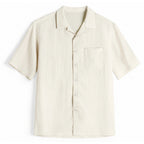 White lyocell camp collar shirt with chest pocket, flat front view