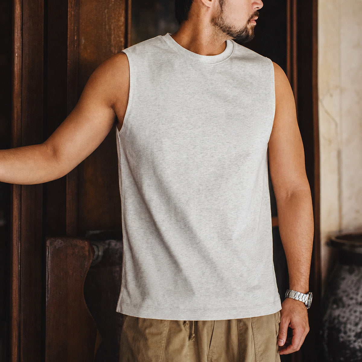 Man wearing the off-white heavyweight tank with khaki trousers
