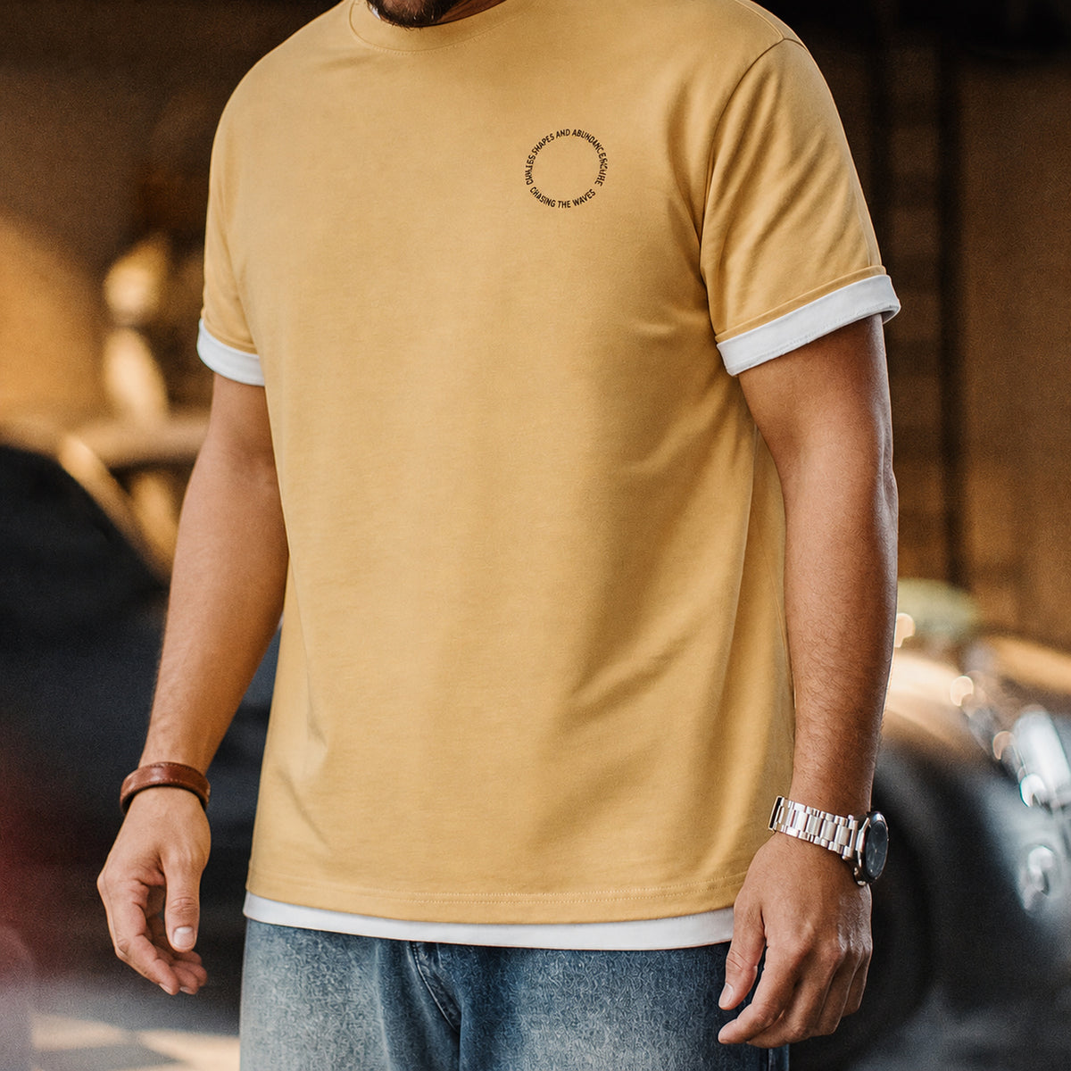 Front view of the mustard tee with small circular chest mark